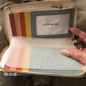 Brand new coach wallet beige. inside compartments for credit cards. Money.